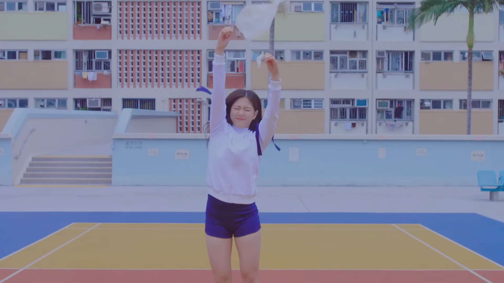 Hyunjin popping a balloon.